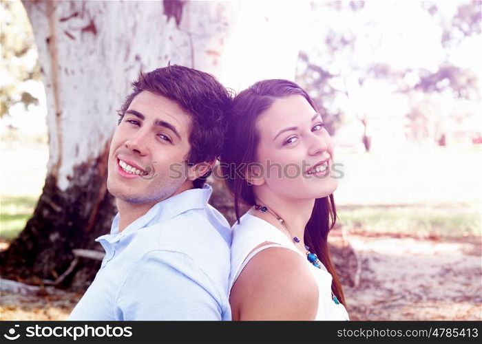 Young couple in the park. Young couple in the park looking at camera