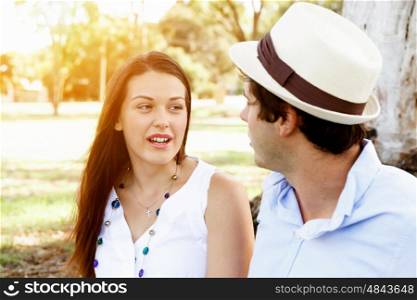 Young couple in the park. Young couple in the park looking at each other