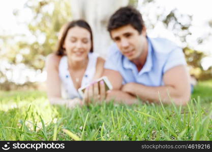 Young couple in the park. Young couple in the park with mobile phone