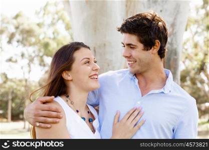 Young couple in the park. Young happy couple in the park in the summer
