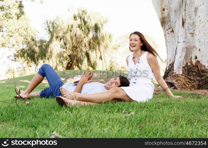 Young couple in the park. Young happy couple in the park in the summer