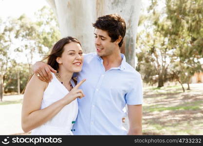 Young couple in the park. Young happy couple in the park in the summer