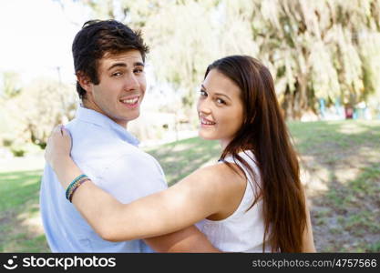 Young couple in the park. Young happy couple in the park in the summer