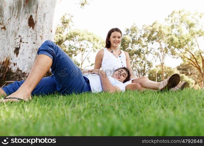 Young couple in the park. Young happy couple in the park in the summer