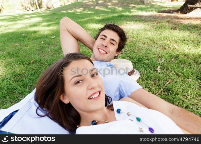 Young couple in the park. Young happy couple in the park in the summer