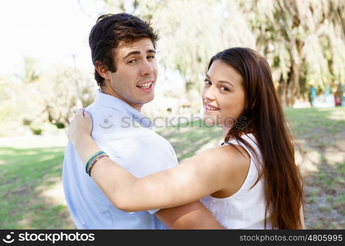 Young couple in the park. Young happy couple in the park in the summer