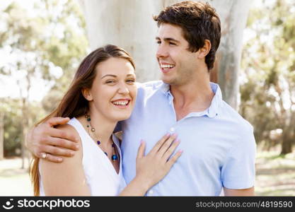 Young couple in the park. Young happy couple in the park in the summer