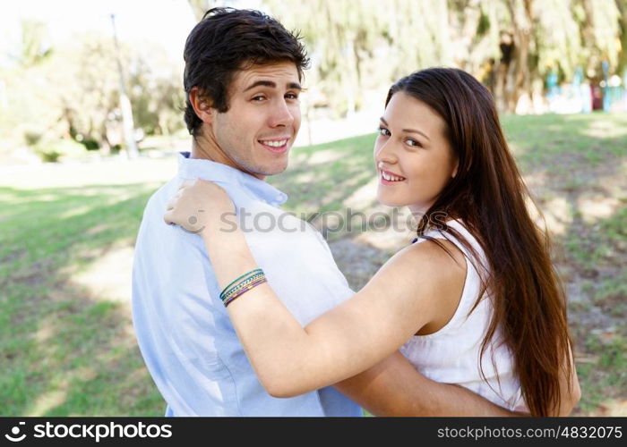 Young couple in the park. Young happy couple in the park in the summer