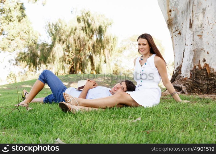 Young couple in the park. Young happy couple in the park in the summer