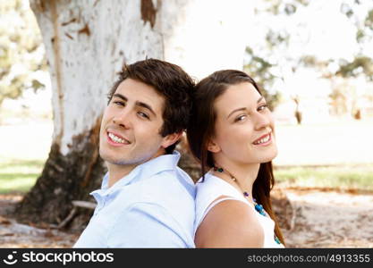 Young couple in the park. Young happy couple in the park in the summer