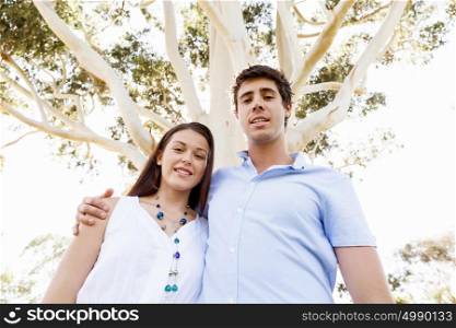 Young couple in the park. Young happy couple in the park in the summer