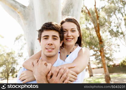 Young couple in the park. Young happy couple in the park in the summer