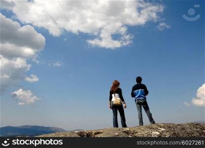 young couple in the top of the mountains
