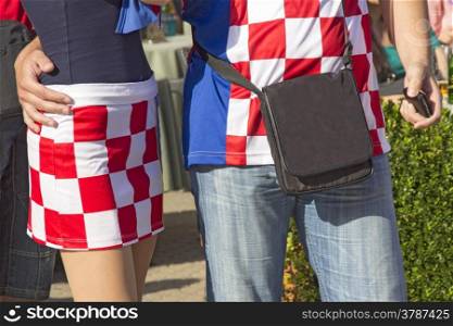 Young couple in traditional uniform of Croatian football fans