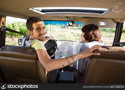 Young couple in vehicle