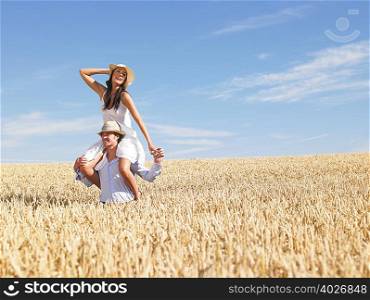 young couple in wheat field