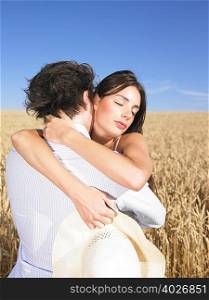 young couple in wheat field