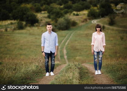 young Couple is having fun on their summer holiday. stylish man and woman are jumping, running and enjoy summer day out of city.. young Couple is having fun on their summer holiday. stylish man and woman are jumping, running and enjoy summer day out of city