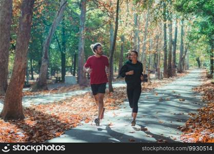 Young Couple Jogging Together in Park. Young Couple Jogging in Park 
