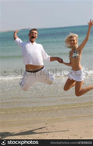 Young couple jumping high