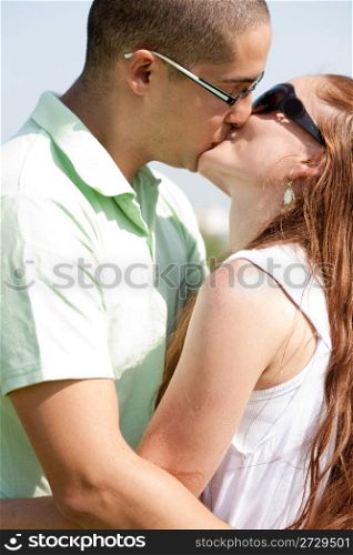 young couple kiss and hug, outdoor
