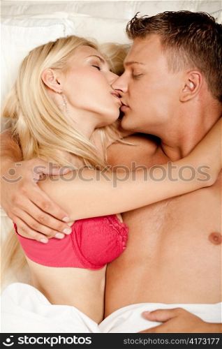 Young couple kissing each other at sleep