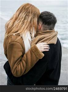 young couple kissing winter outside
