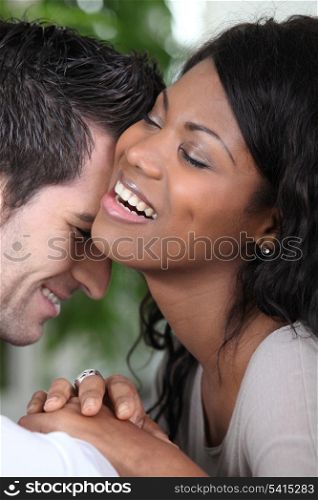 Young couple laughing intimately