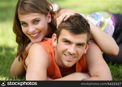 Young couple laying in the park