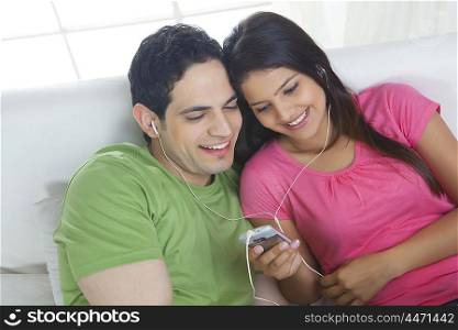 Young couple listening to music