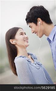 Young Couple Listening to Music Together
