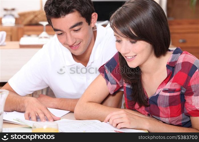 Young couple looking at documents together