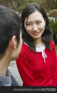 Young couple looking at each other smiling