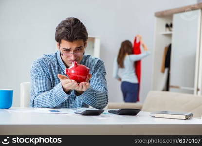 Young couple looking at family finance papers