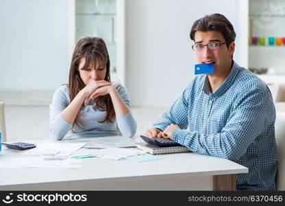 Young couple looking at family finance papers