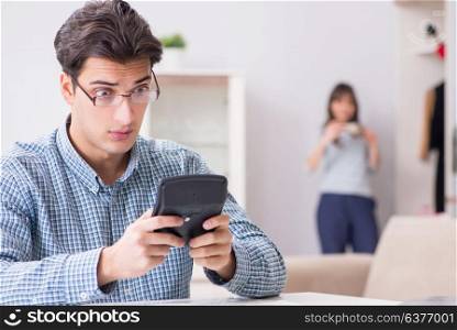 Young couple looking at family finance papers