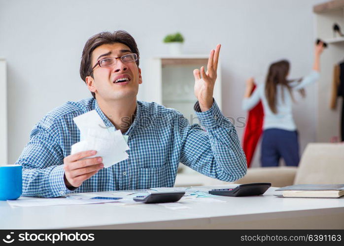 Young couple looking at family finance papers