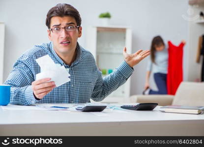 Young couple looking at family finance papers