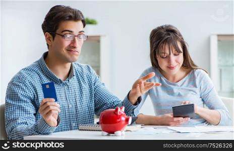 Young couple looking at family finance papers. The young couple looking at family finance papers