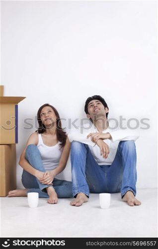 Young couple lost in thoughts
