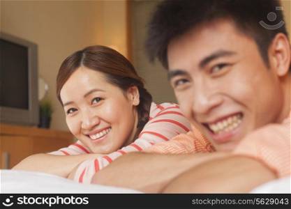 Young Couple Lying on Bed