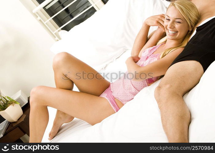 Young couple lying on the bed