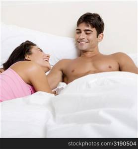 Young couple lying on the bed
