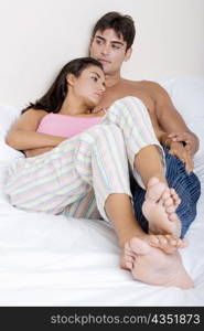 Young couple lying on the bed