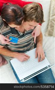 Young couple making purchases online