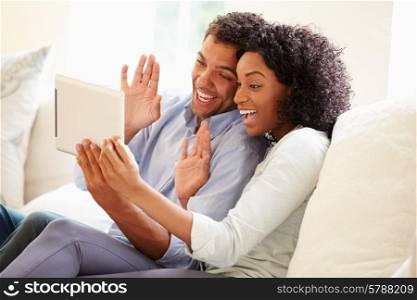 Young Couple Making Video Call Using Digital Tablet