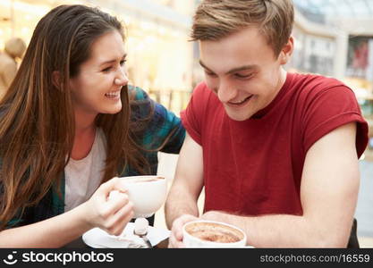 Young Couple Meeting On Date In Cafe