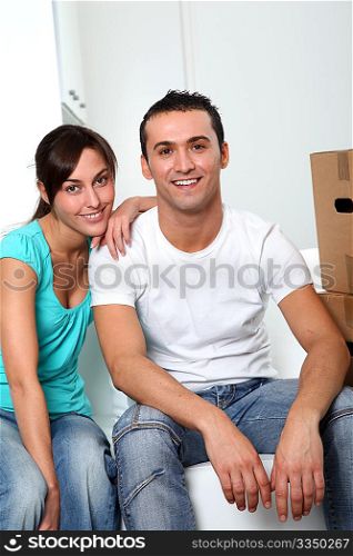 Young couple moving in new place