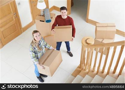 Young Couple Moving In To New Home