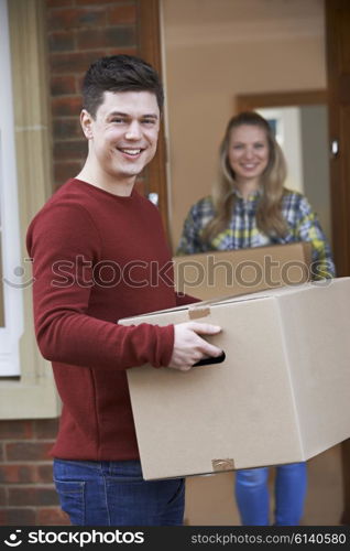 Young Couple Moving In To New Home Together